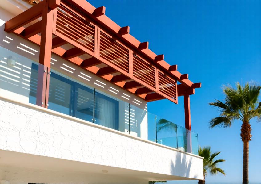 Luxury coastal villa with terracotta-red aluminum louvers for sun shading and aesthetic appeal
